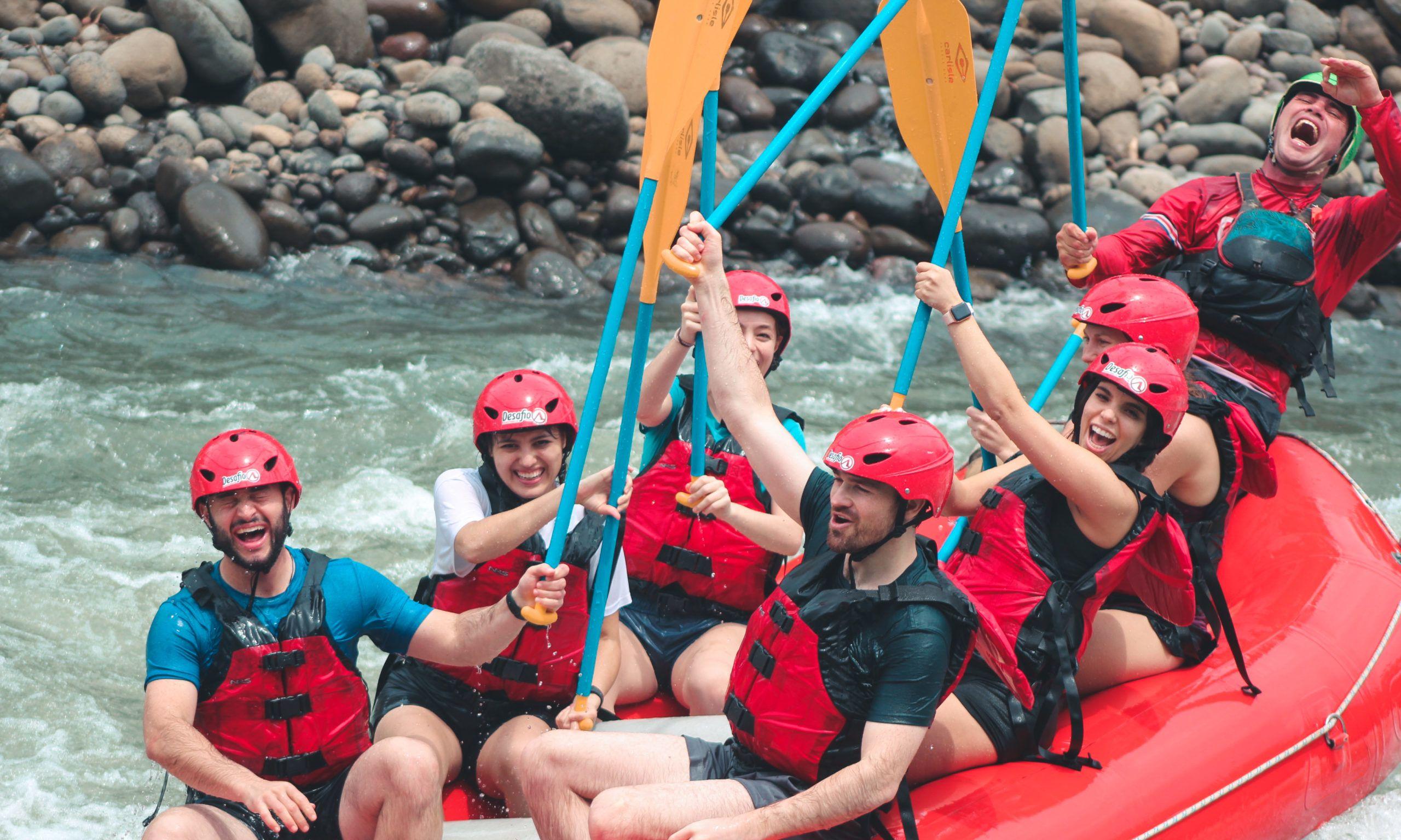 Travelers celebrating together after rafting in Costa Rica